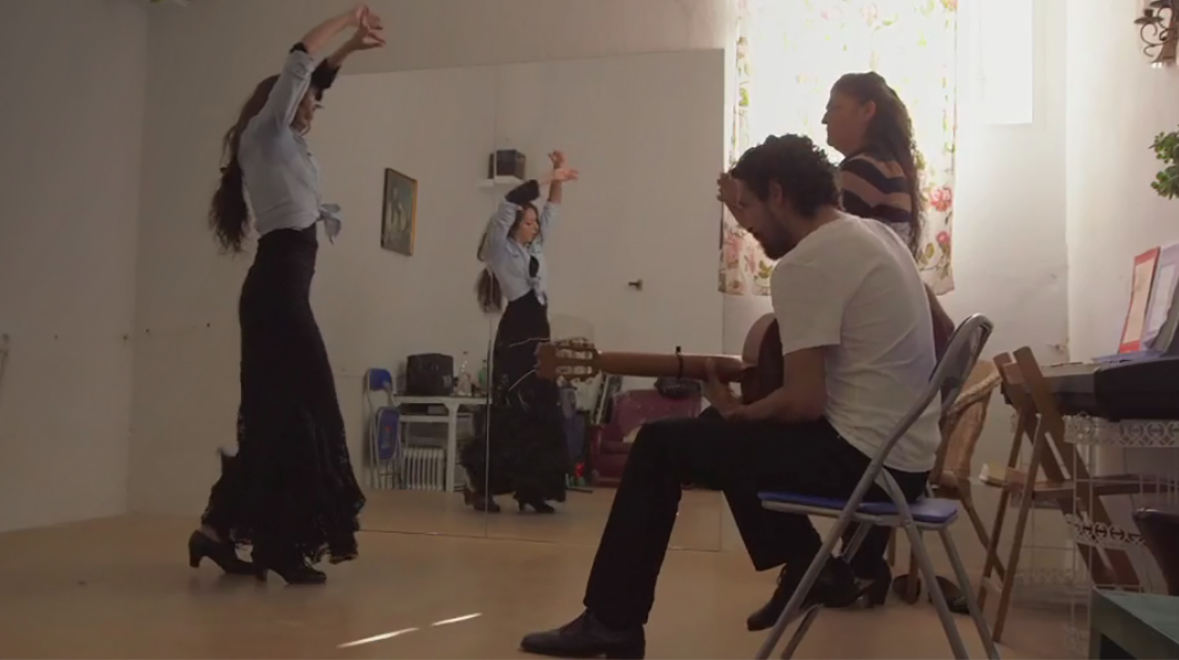 Juan Ramirez plays the Flamenco guitar for a dancer and her teacher.