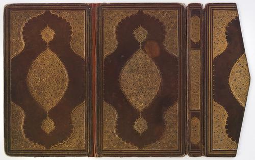 Brown leather book binding covers open flat with flap, decorated with central medallions and cornerpieces of gold-stamped floral motifs and cloudbands, the flower heads picked out in blue, spine with calligraphic panel.