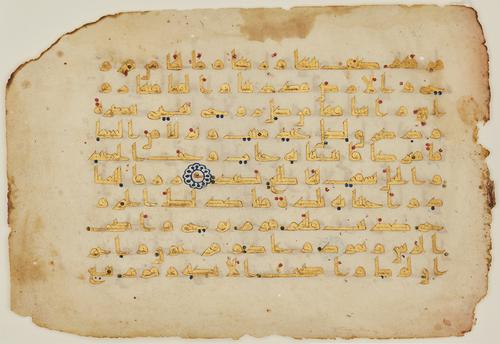 Fine kufic script in gold on vellum, with 10 lines per page, letter-pointing of very thin, diagonal dashes in light brown ink, vocalisation of red, blue and green dots, tenth verses marked within the text with abjad letters on gold kufic surrounded by a floral roundel in blue.