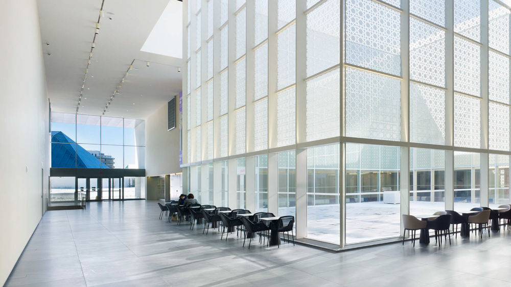 The modern architecture of the Aga Khan Museum is seen in a photo of its interior atrium.
