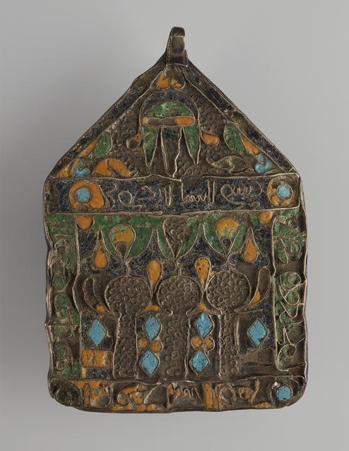 Pentagon-shaped pendant decorated with cloisonne enamels in green, yellow and turquoise blue against a background of small wire circles.