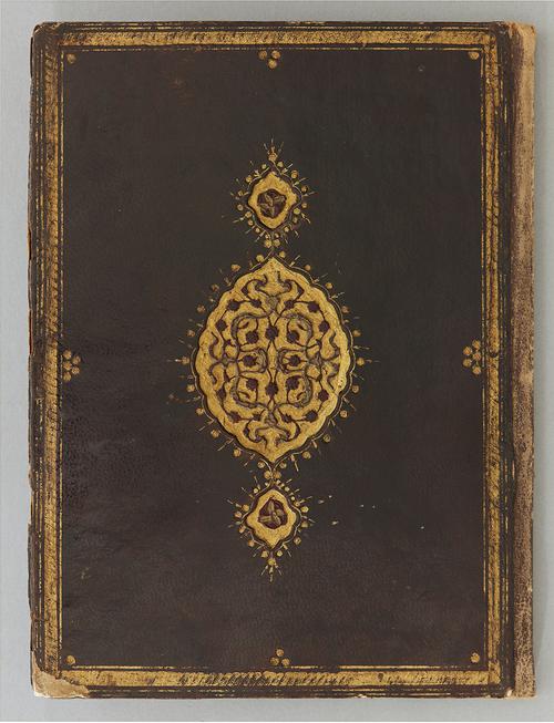 Dark brown leather binding with central gold medallion of stamped cloud-bands and floral scrolls and gilt outer frame; doublures pasted over with plain paper.