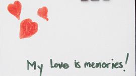 "My love is memories" written on a white background with red hearts.