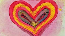 Multicolour heart painted on a pink background.