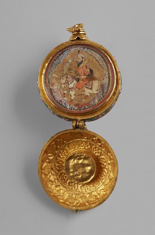 Open to the opposite larger compartment, that features a miniature on paper of a mounted Sikh noble with attendant, with two ornate loops, one unscrewing to reveal a narrow rod housed within a reservoir in the case interior.