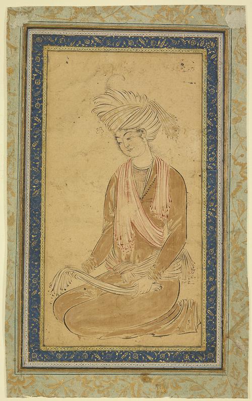 Drawing of a young man seated on his knees with a turban on, surrounded by a blue boarder with gold floral illumination, set on a green paper with larger gold floral illumination.