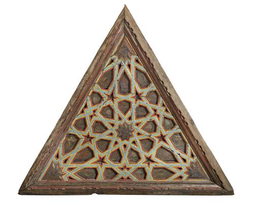 One of three, wooden Equilateral triangular forms,  featuring beams forming radiating multi pointed stars, painted with a floral designs, the beams painted bright red, yellow and light blue, moulded unpainted frame.