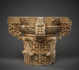 Capital of typical form with floral designs crisply carved, traces of red pigment, original lines visible on top and base for carving from the block.