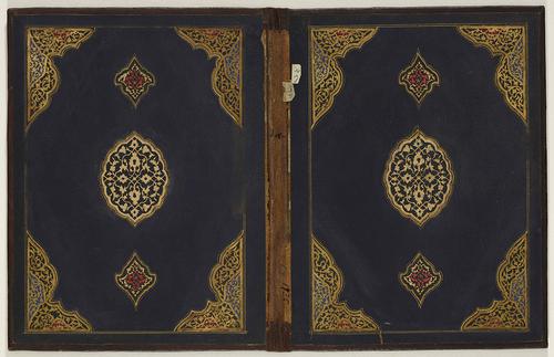 Doublure of Turkish book binding laid flat, edges and spine are brown leather whereas the inner is black pasteboard. Corner decorations are golden, with hints of red and blue. The centre motif is prominently gold, both sides are a mirror image of one another. 
